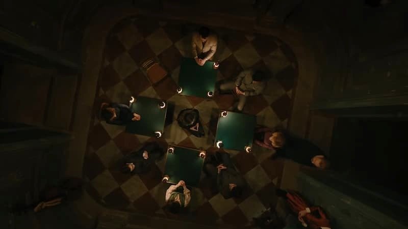 A séance in A Haunting in Venice
