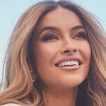 Chrishell poses in white dress