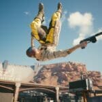 V aims her pistol while falling in Cyberpunk 2077