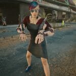 V poses with her Mantis Blades in Cyberpunk 2077