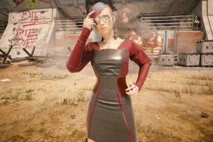 V poses near an explosion in Cyberpunk 2077