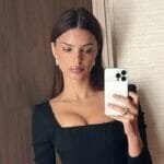 Emily take mirror selfie in Paris
