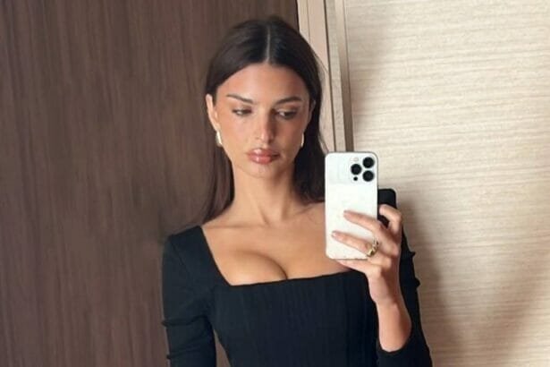 Emily take mirror selfie in Paris