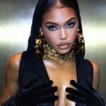 Lori Harvey showing curves in black dress
