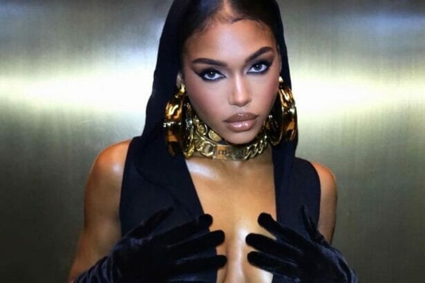 Lori Harvey showing curves in black dress