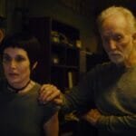 Amanda and John looking at the Saw X Fresh score for the franchise's first on Rotten Tomatoes