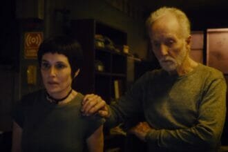 Amanda and John looking at the Saw X Fresh score for the franchise's first on Rotten Tomatoes